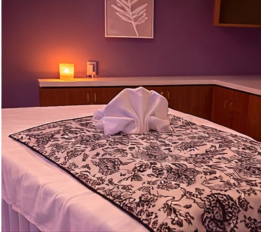 Relaxing massage bed with towel swan at Crystal Spa